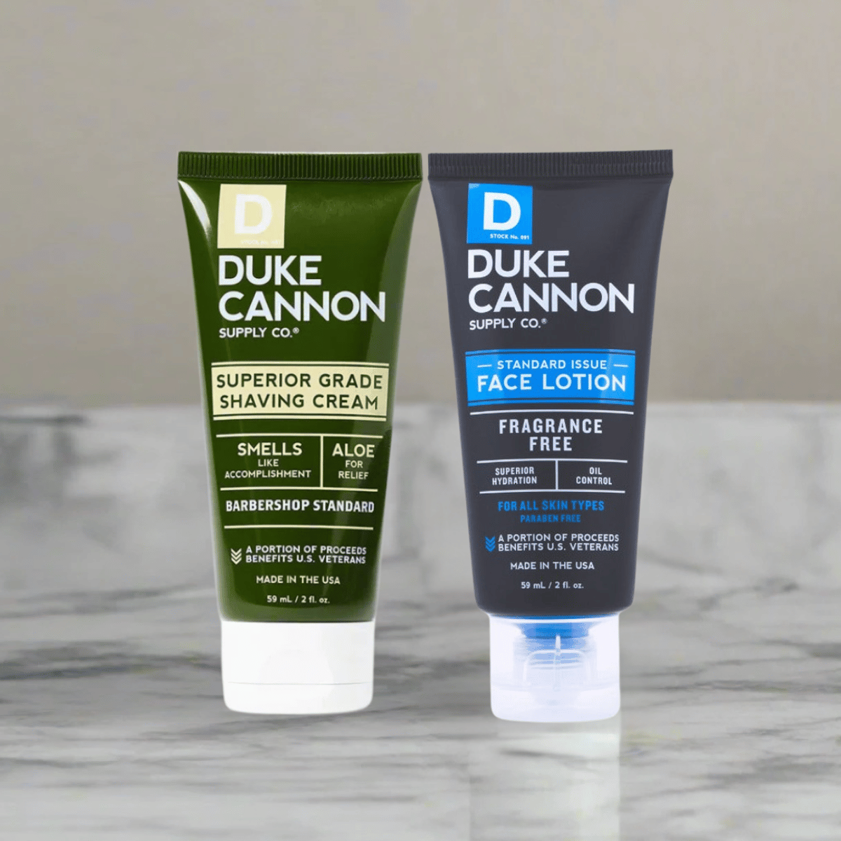 Two Duke Cannon skincare products on a marble surface