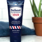 A tube of Barbasol Classic Shaving Cream with a blue and white color scheme, featuring the year 1919 and branding details.