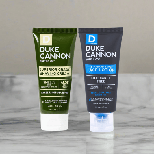 Two Duke Cannon skincare products on a marble surface