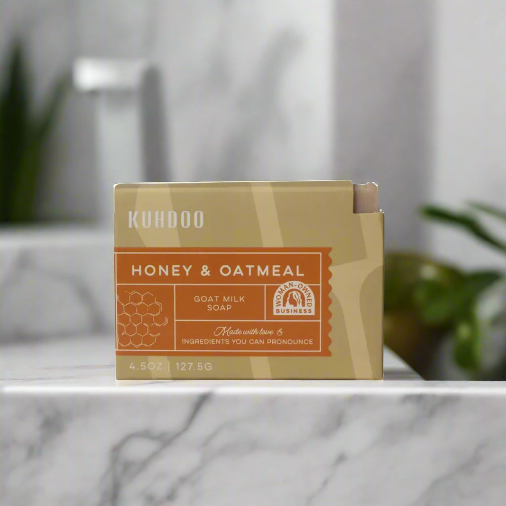 Kuhdoo soap bar with honey and oatmeal label on a white background