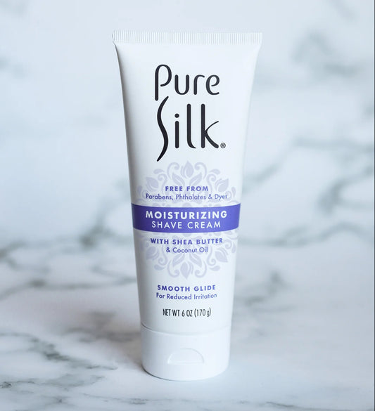 Pure Silk moisturizing shave cream tube on a marble surface